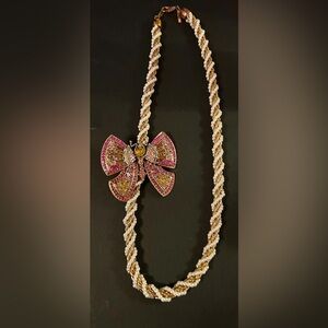 Vintage Pink and Gold Butterfly broach on a “Casual Corner”  Necklace